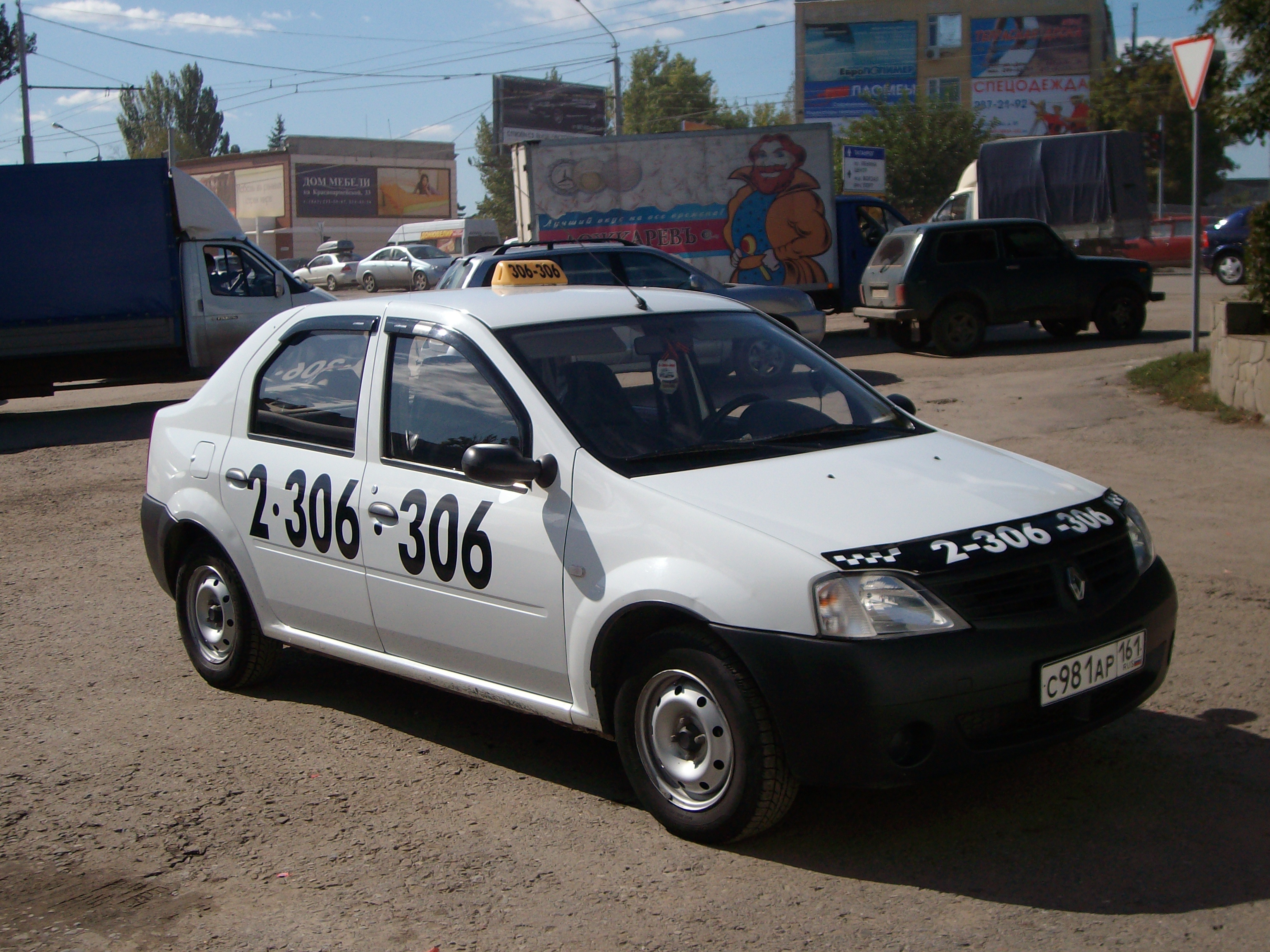 Номер телефона такси в ростове на дону. Рено Логан такси 306 306. Белое такси. Такси Ростов-на-Дону.